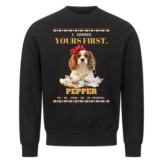 I Opened Yours First custom pet sweatshirt black - your dog behind a pile of torn wrapping paper with a red gift bow on its head, gift-box knit border, with name