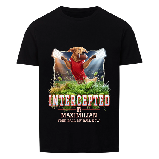 Black T-shirt front print: dog in a red jersey catching a football mid-leap above flying turf, varsity title "Intercepted by" with the dog's name and "Your ball. My ball now."